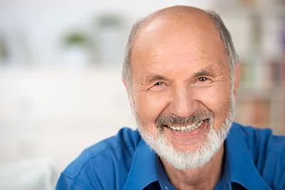 man smiling with fillings from Serenity Smiles