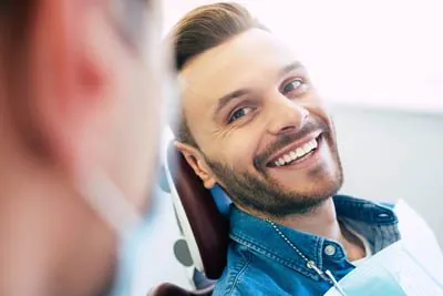 man smiling during his cosmetic dentistry appointment at Serenity Smiles