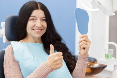 woman loving her dental implants from Scottsdale, AZ
