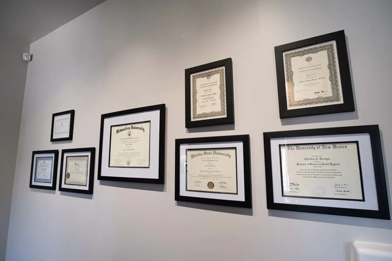 dental awards on the wall at Serenity Smiles