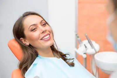 woman smiling during her appointment to Serenity Smiles