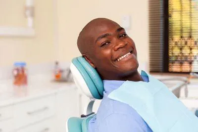 man smiling during his smile makeover appointment at Serenity Smiles