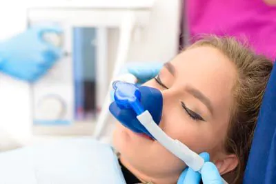 woman relaxed during a procedure at Serenity Smiles
